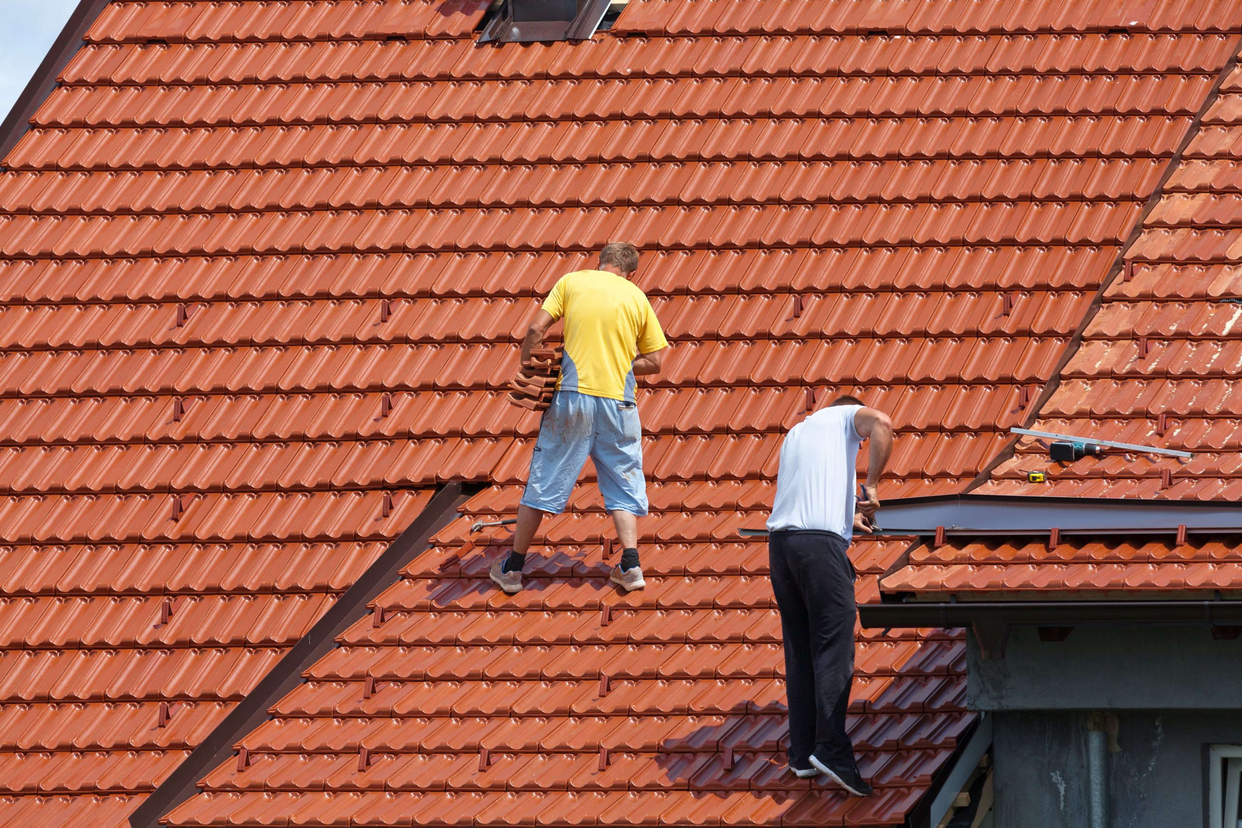 Man working on the roof of a building